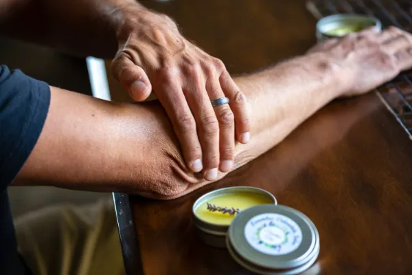 rubbing sport salve on skin